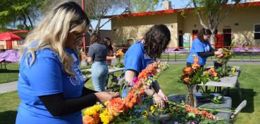 Students working on flower arrangements